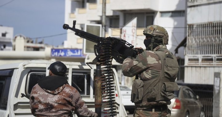Syria government fighters clash with Assad loyalists, nearly 200 killed – National | Globalnews.ca